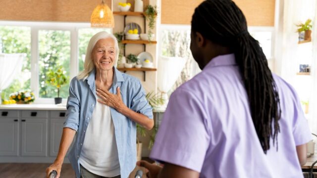 african-social-worker-taking-care-senior-woman-e1696937986217